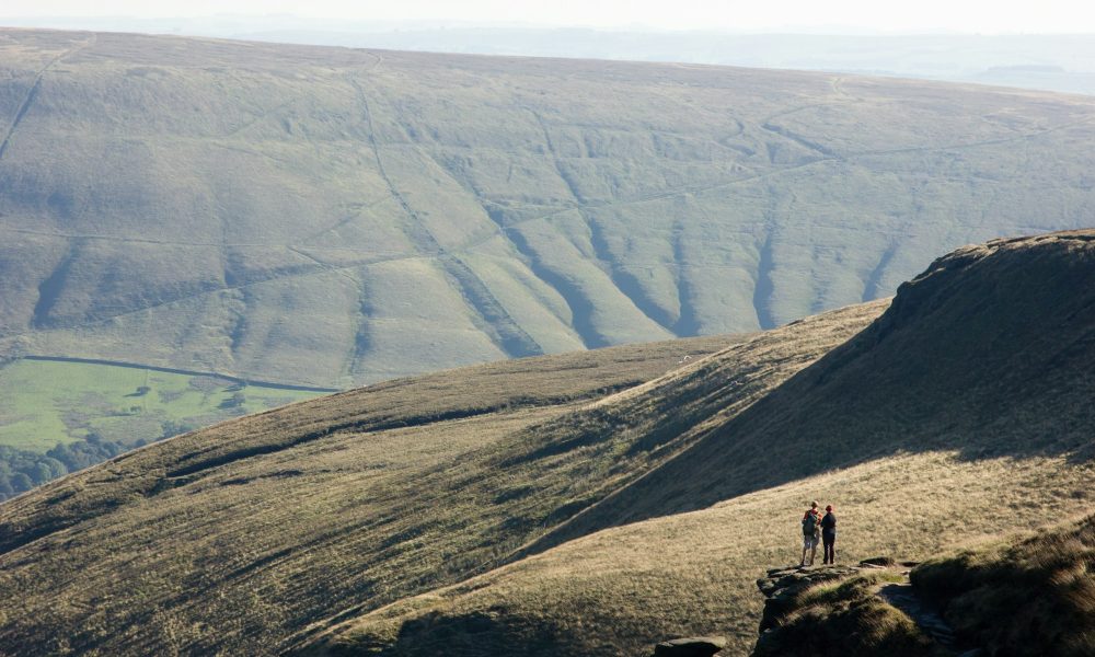 Hikers on a mountain in Derbyshire, England